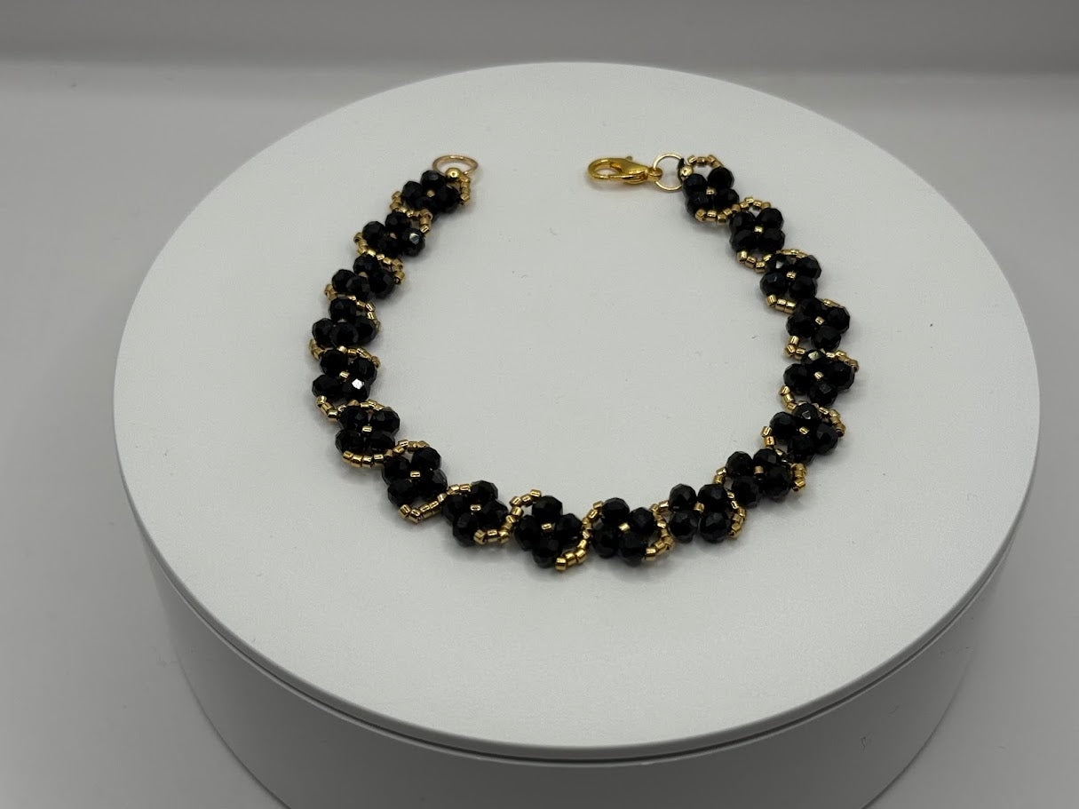 Perlenarmband Schwarz-Gold